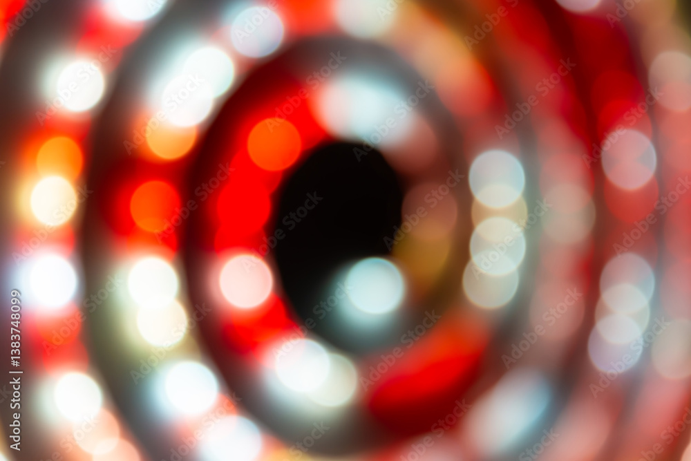 Abstract red and white lights in spiral circle, abstract holiday background