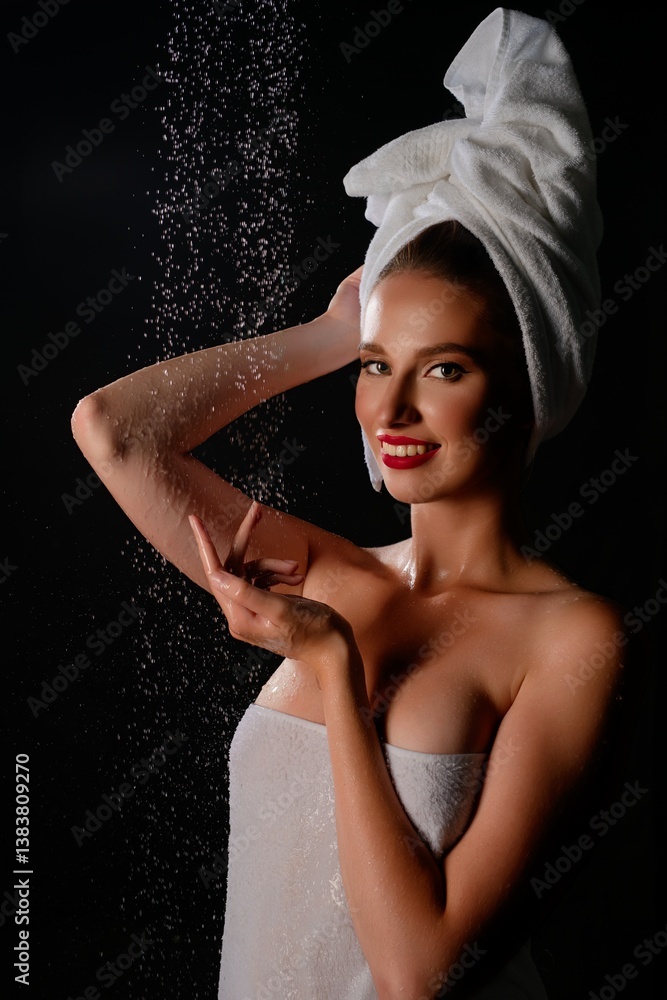 Fototapeta premium Beauty portrait of a woman in lingerie with towel in studio setting