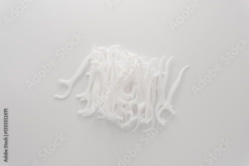 floss sticks for teeth on white background