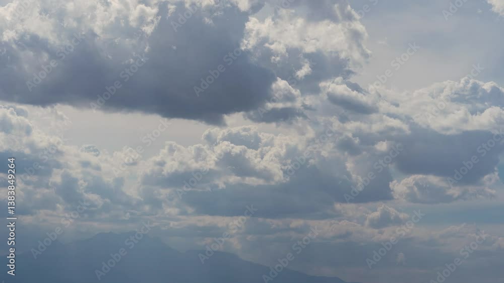Accelerated 4k video of thunderstorm clouds in bright sunlight Accelerated 4k video of thunderstorm clouds in bright sunlight