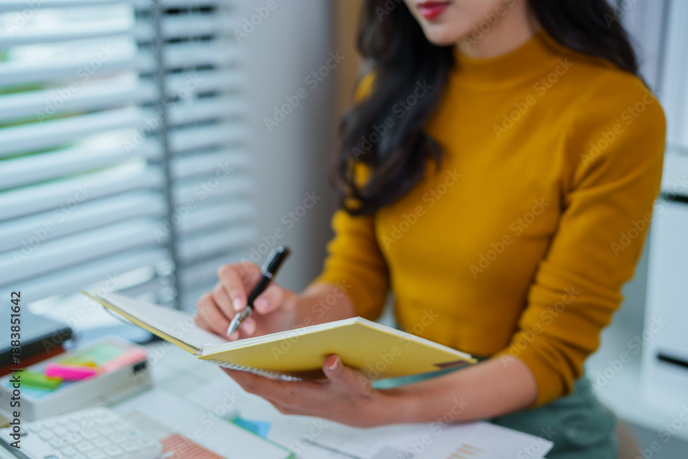 Asian woman in yellow shirt talking business in office
Asian woman in yellow shirt talking business in office