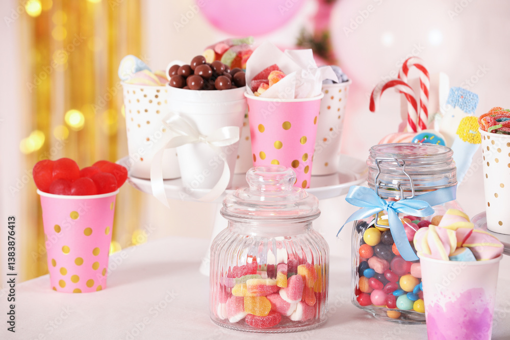 Candy bar. Many different sweets on table in festive decorated room Candy bar. Many different sweets on table in festive decorated room