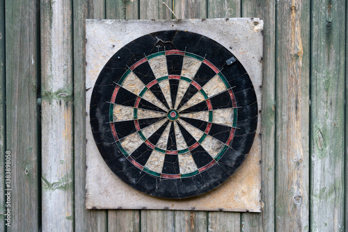 Wallpaper Mural Vintage Dartboard on a weathered wooden background Torontodigital.ca