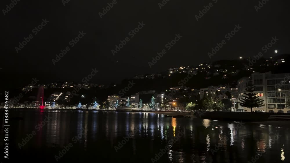 Night lights glittering in the ocean view coastal area in the port city of Wellington, New Zealand. Night lights glittering in the ocean view coastal area in the port city of Wellington, New Zealand.