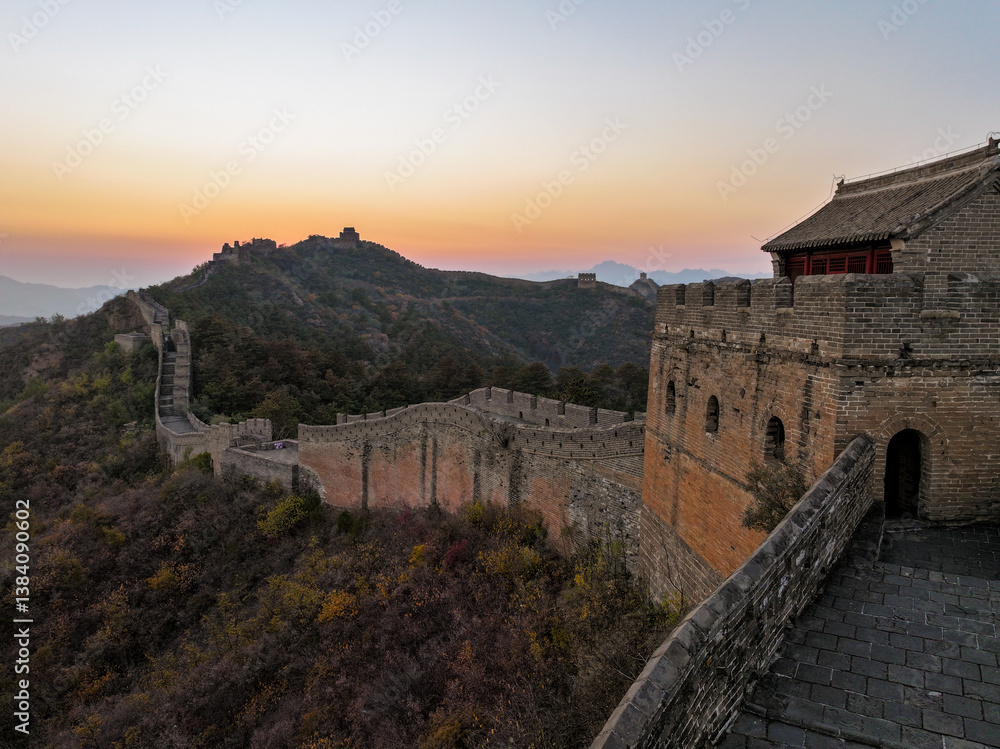 Great wall of China at sunset with rolling hills at dusk Great wall of China at sunset with rolling hills at dusk