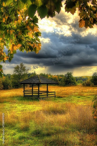 Autumnal Gazebo in a Field Under a Stormy Sky