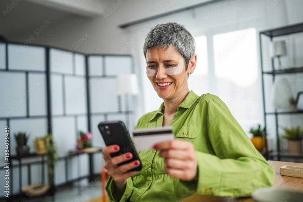 mature woman use mobile phone and credit card for online shopping mature woman use mobile phone and credit card for online shopping