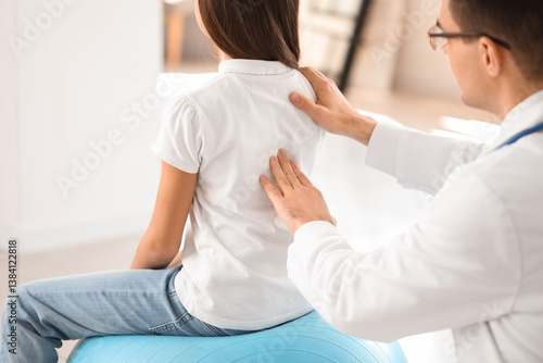 Doctor checking posture of ...