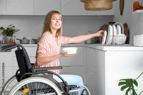 Young woman in wheelchair t...