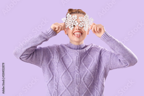 Happy young woman in warm s...