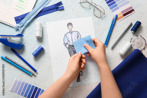 Female fashion designer hol...