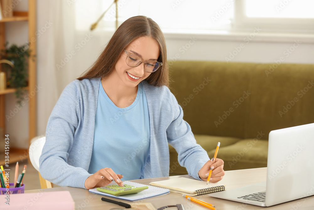 Female tutor with calculator giving online Math lesson at home Female tutor with calculator giving online Math lesson at home