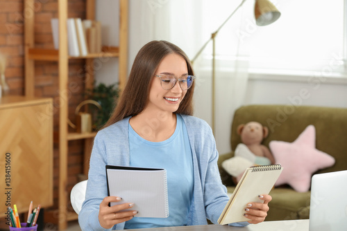 Female tutor with notebooks...