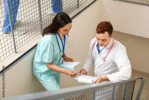 Young doctors with clipboar...