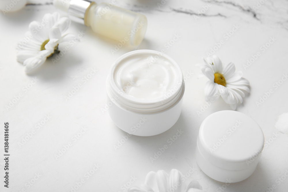 Cosmetic cream, serum and beautiful flowers on light background Cosmetic cream, serum and beautiful flowers on light background