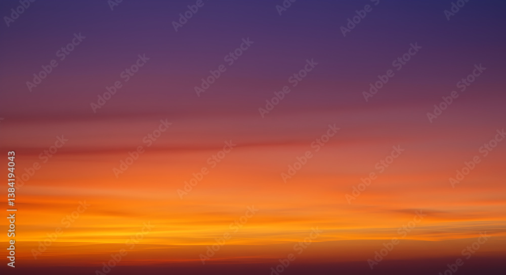 Naklejka premium Spectacular Sunset Sky Painted in Vivid Tangerine and Violet Hues