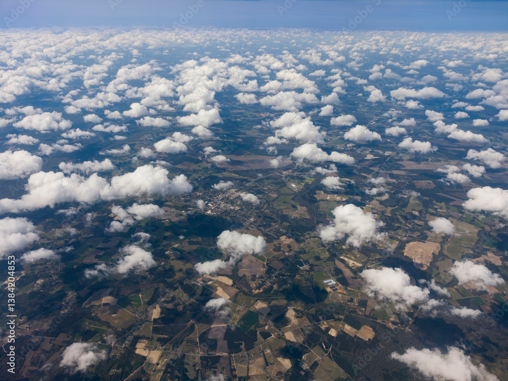 High altitude photograph of sky, clouds and landscape