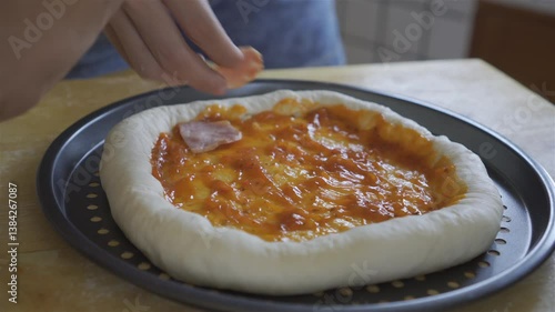 Homemade pizza. baker decorates pizza from oven .