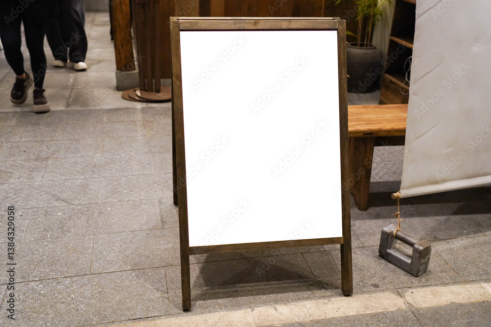 white blackboard advertising sign or customer stopper at sidewalk cafe