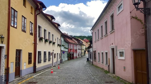 Classic medieval cobblestone street of European town. Enchanting European street with colorful buildings and cobblestone road. Cesky Krumlov, Czech Republic. Europe.