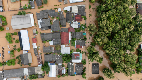 Aerial view of local house in suburb area in Chiang Rai downtown flooding by Kok river after typhoon Yagi has swept Southeast Asia.