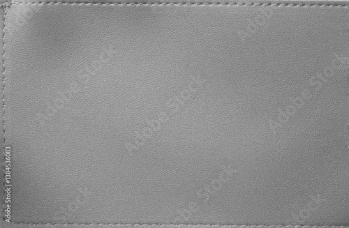 Grey leather texture with thread patterns arround background