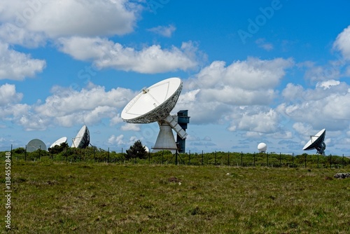 Fototapeta Naklejka Na Ścianę i Meble -  Helston England - 11 June 2024 - Satellite dishes on the Goonhilly Satellite Earth Station on the Goonhillly Downs on the Lizard Peninsula in Cornwall England