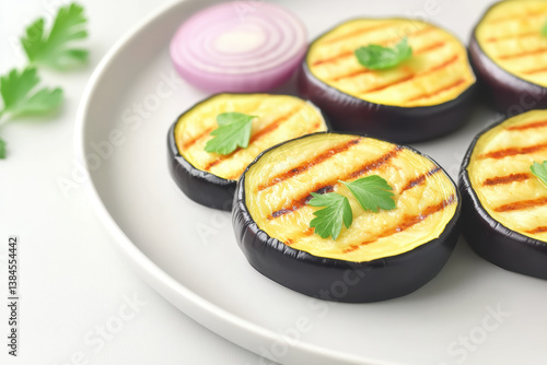 Grilled eggplant slices topped with fresh herbs create delicious plant based dish perfect for healthy recipes