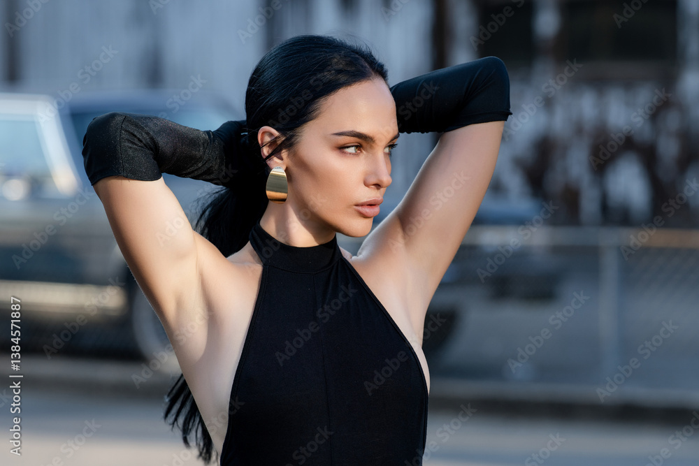Portrait of Beautiful brunette woman posing on the street. Close-up woman portrait of young pretty trendy girl, summer street fashion. High fashion portrait of elegant woman outdoor. Beauty face.