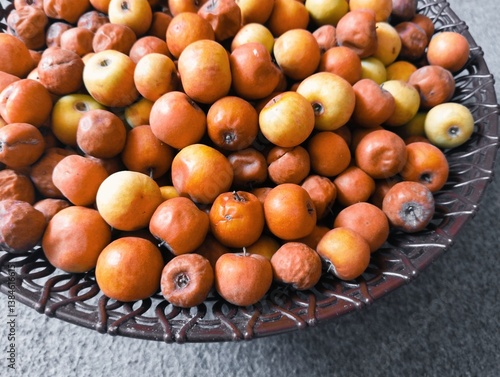 ripe ber fruits stacked together in a basket, closeup of fresh and shriveled jujube fruits, harvested indian berries fruit