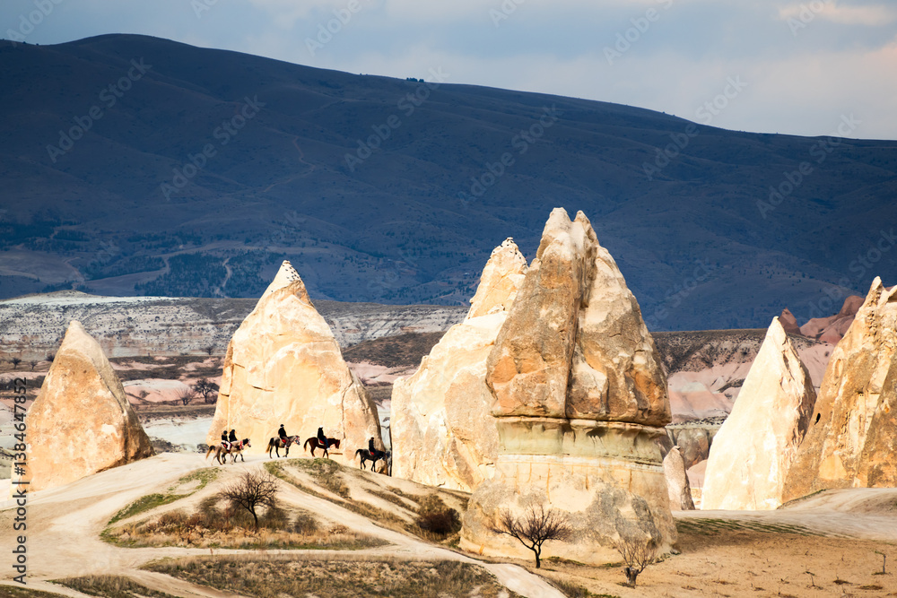 Old cave houses and rock formations near Goreme village, Cappadocia, Turkey