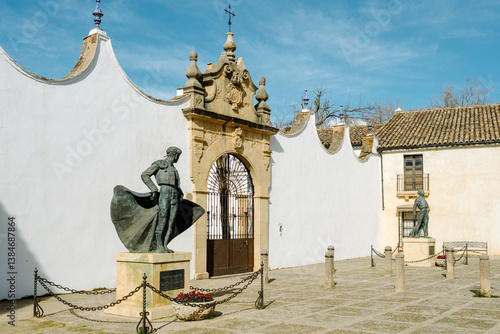 Ronda, Andalusia, Spain - The entrance to the bullring with the statue of the bullfighter Cayetano Ordóñez