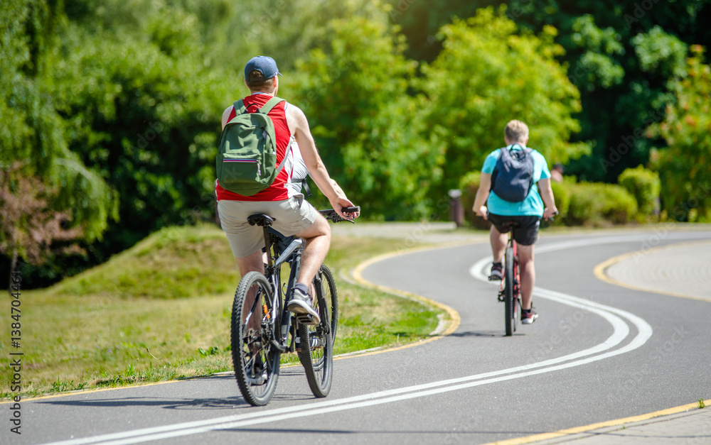 Cyclists ride on the bike path in the city Park
Cyclists ride on the bike path in the city Park