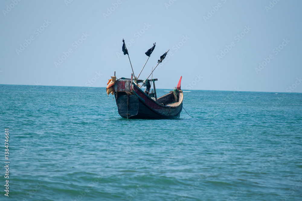 Fototapeta premium Traditional colorful wooden fishing boats on the Coast of Saint Martin’s Island, Bangladesh.