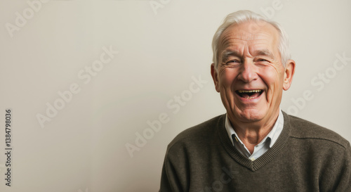Enthusiastic senior man laughing with genuine joy. Active aging and happiness in retirement concept