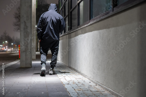 Photos depressed looking man walking city street during night