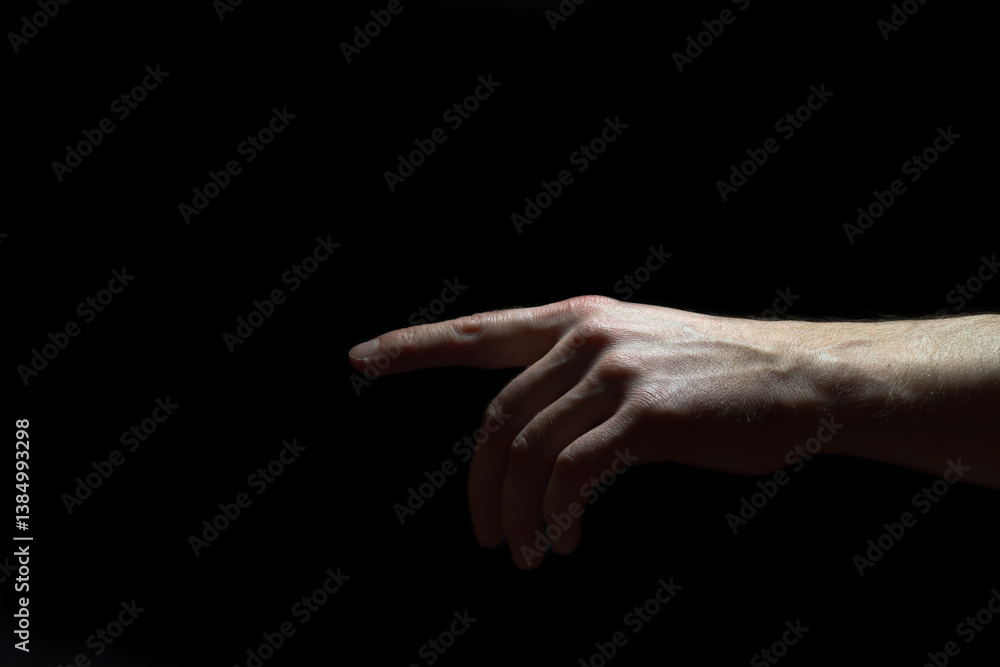 Fototapeta premium Male hand on black background