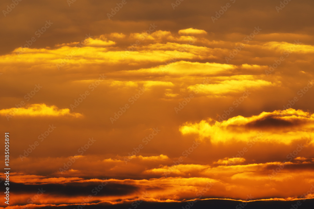 Fototapeta premium beautiful and dramatic sunset sky with bright yellow clouds as abstract background