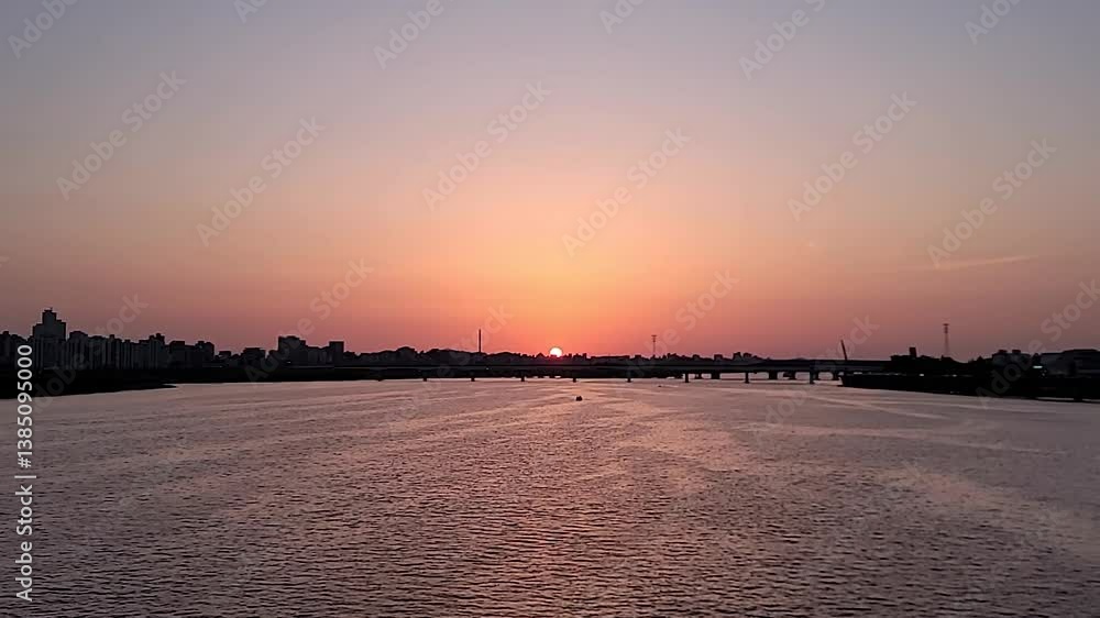Beautiful Sunset landscacpe over the Hangang River, in Seoul, South Korea, in a serene and peaceful atmosphere Beautiful Sunset landscacpe over the Hangang River, in Seoul, South Korea, in a serene and peaceful atmosphere