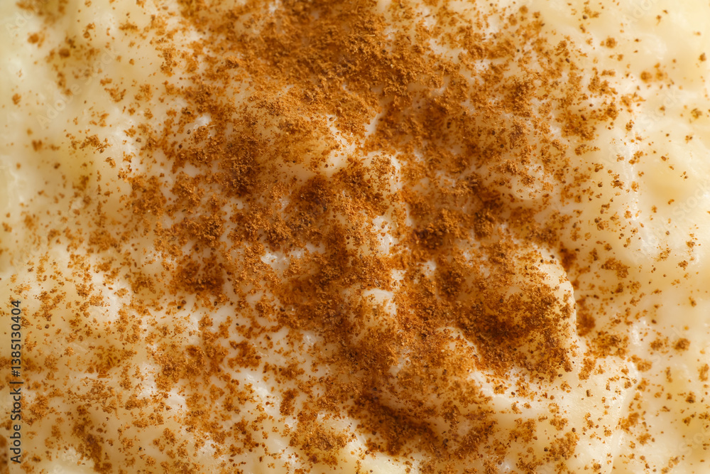 Delicious rice pudding with cinnamon as background, closeup Delicious rice pudding with cinnamon as background, closeup