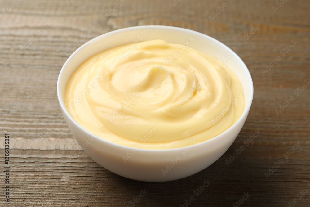 Tasty vanilla pudding on wooden table, closeup Tasty vanilla pudding on wooden table, closeup