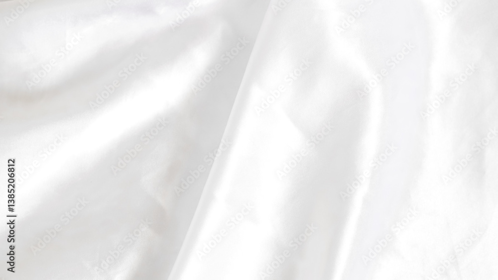 Obraz premium Smooth white silk fabric with soft folds and gentle light reflections