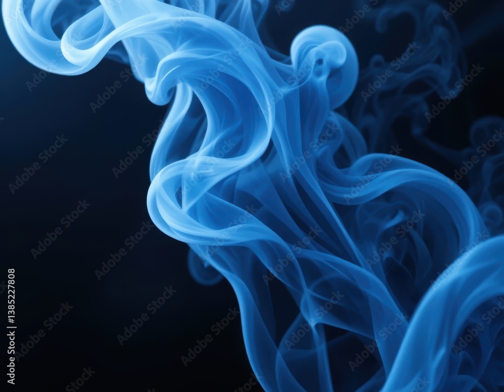 Obraz premium Ethereal blue smoke against black background