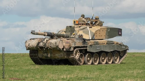 commander and gunner directing Challenger 2 II tank FV4034 in action on a military exercise
