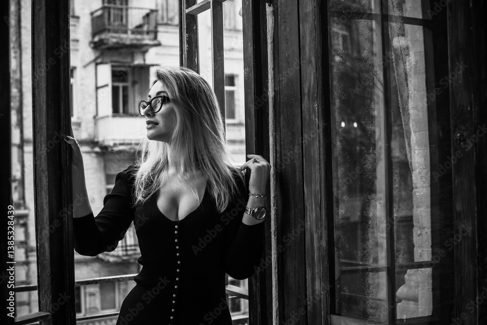 Obraz premium Portrait of nice romantic woman in black midi dress. Clothes mix style. Middle aged lady, fashion concept 