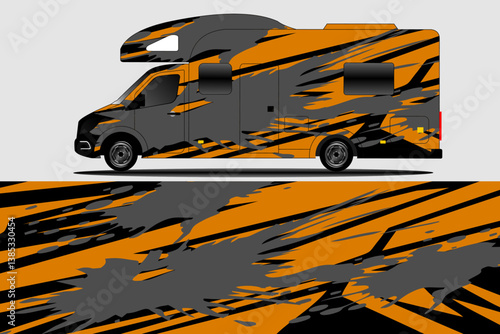 Vibrant RV with Abstract Orange and Black Design Parked Against a Neutral Background