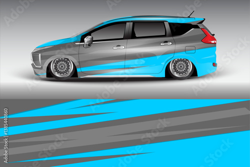Sleek modified car with blue and gray design parked against a gradient background, showcasing custom wheels