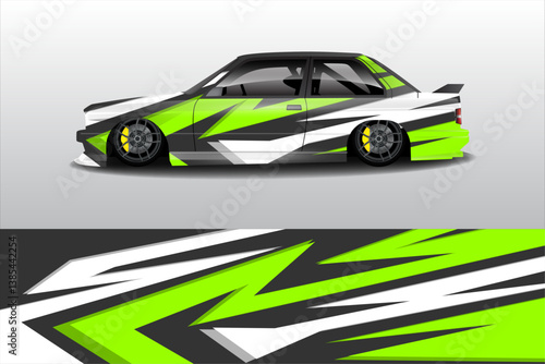 Stylish modified car with vibrant green and black graphics, showcasing sleek design and lowered stance