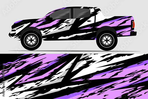 Stylishly designed pickup truck with a vibrant purple and black graphic wrap, showcased on a neutral background