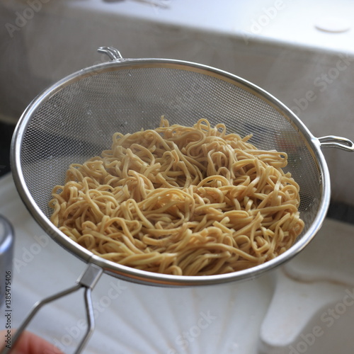 boiled egg noodles in colander